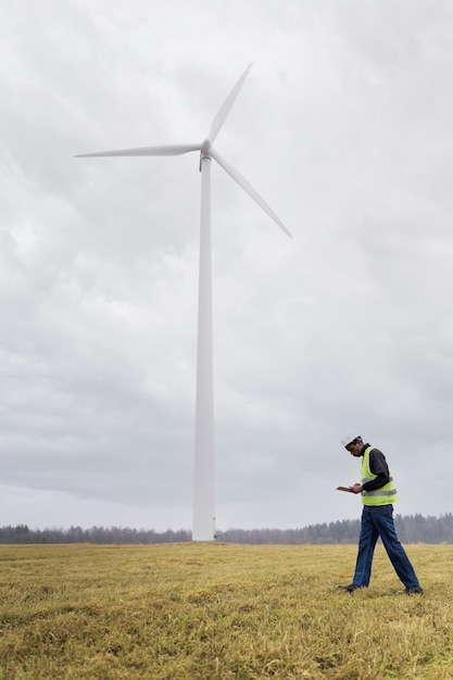 Full shot engineer wearing safety helmet outdoors