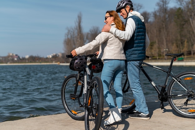 Free photo full shot family cycling together