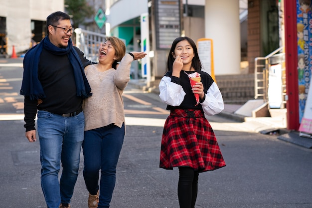 Full shot family members walking together