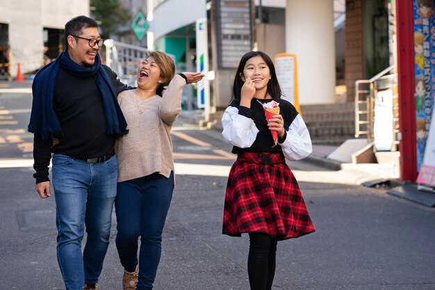 Full shot family members walking together