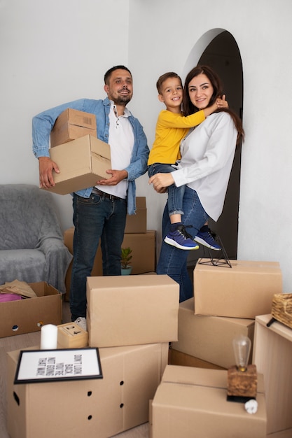 Free photo full shot family ready to move into a new home