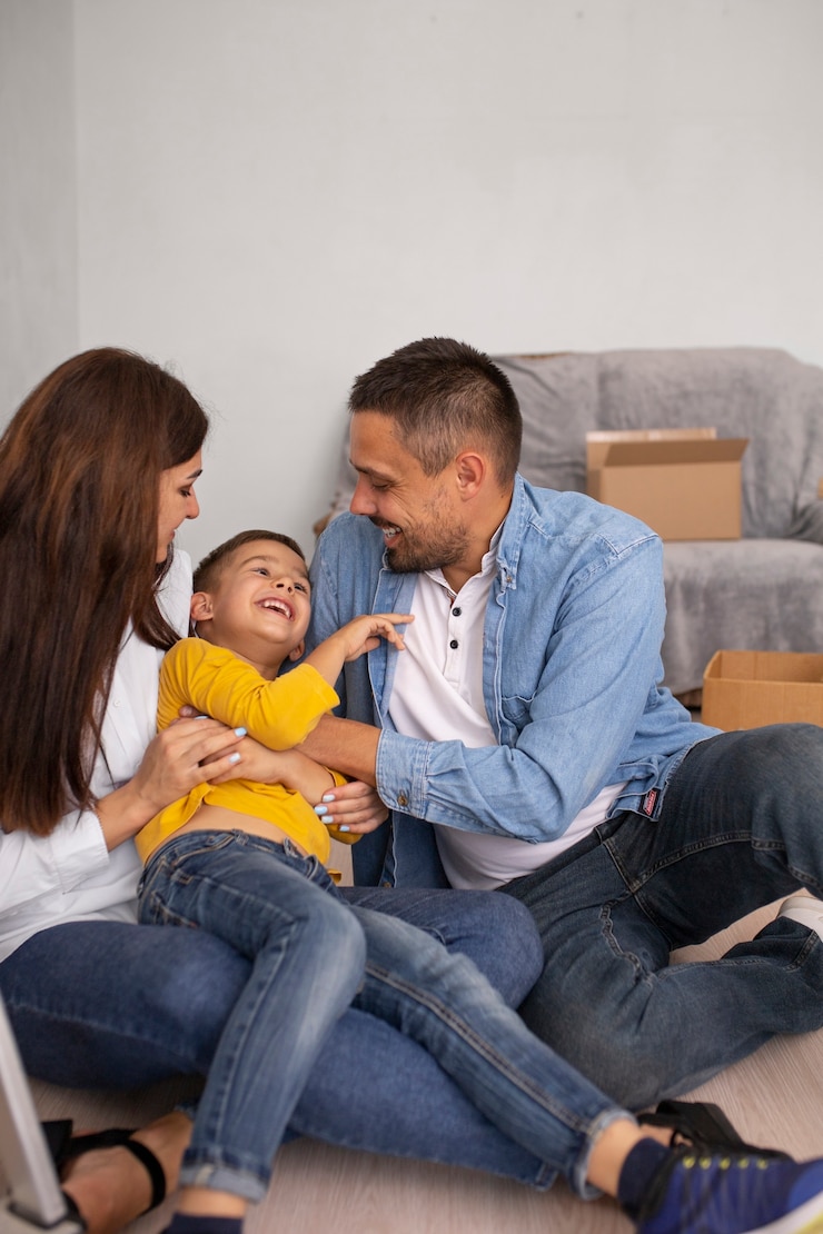 Free Photo full shot family ready to move into a new home