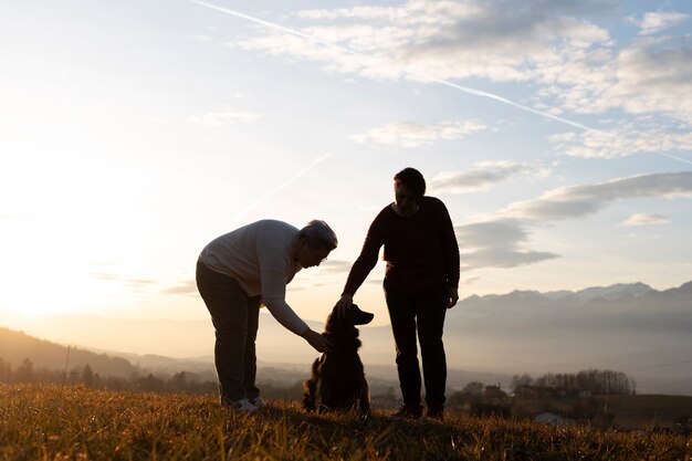full shot family silhouette in nature at sunset