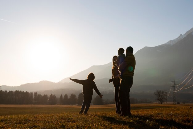 full shot family silhouette in nature