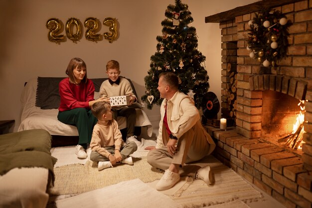 Free photo full shot family spending time indoors