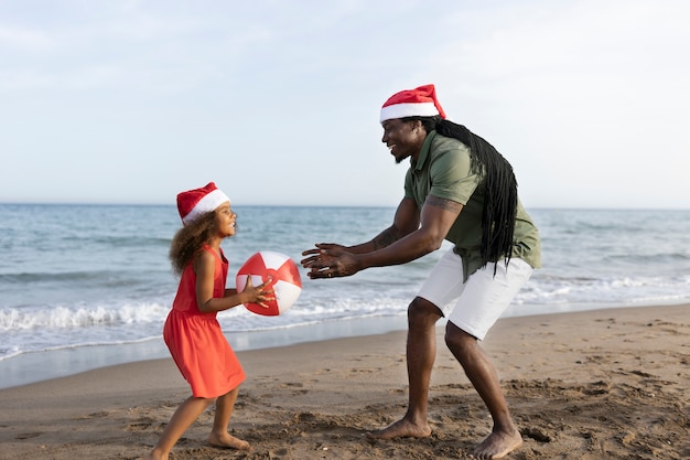 Full shot father and girl playing