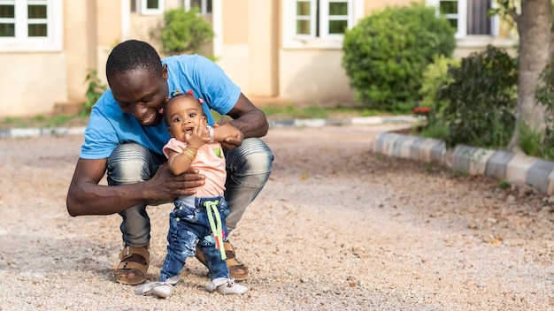 Full shot father and little kid