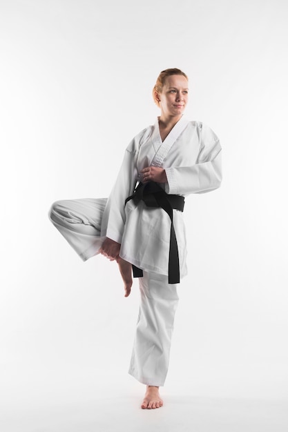 Full shot of female karate fighter