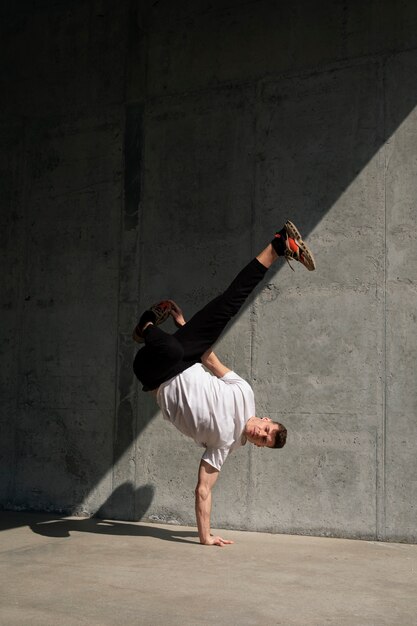 Free photo full shot fit man doing  parkour training