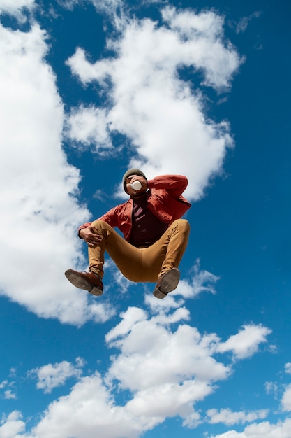 Full shot fit man jumping outdoors