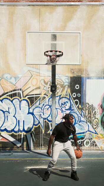 Full shot fit man playing basketball