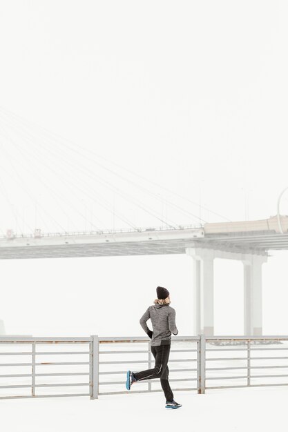 full shot fit man running outside