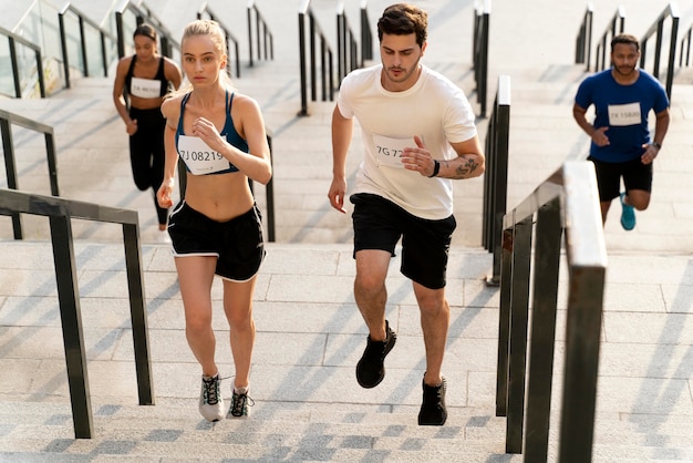 Full shot fit people running on stairs