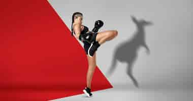 Free photo full shot fit woman boxing