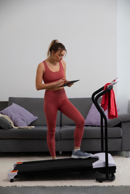 Full shot fit woman on treadmill