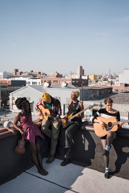 Full shot friends making music together