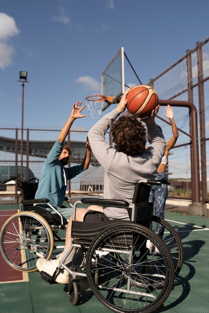 Full shot friends playing basketball