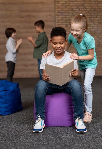 Full shot friends reading together