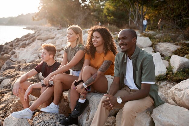 Full shot friends sitting together