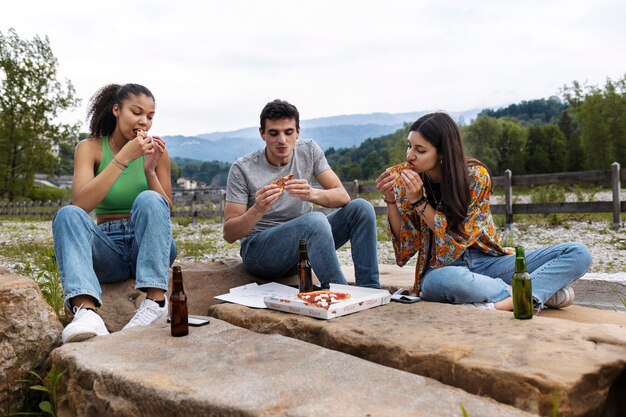 Full shot friends spending time outdoors