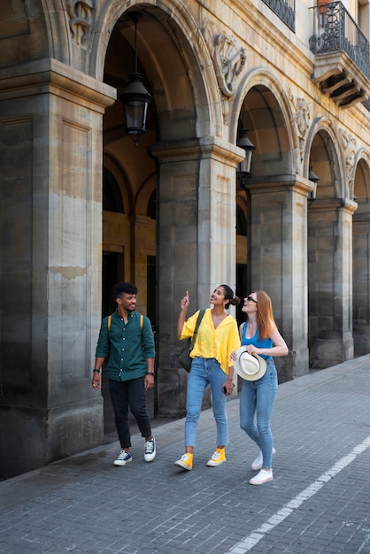 Free photo full shot friends walking together outdoors