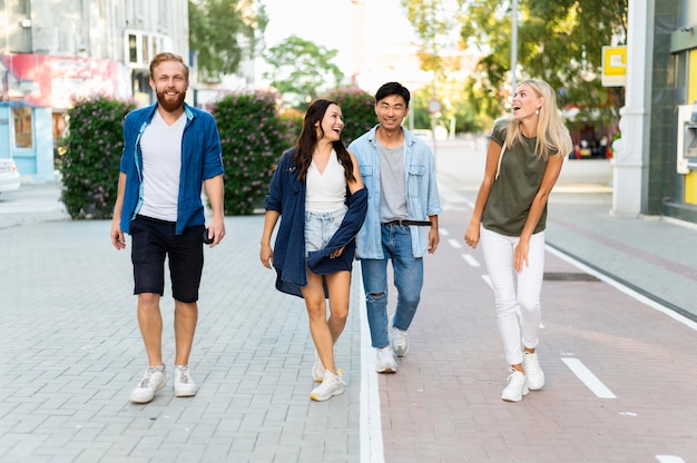 Free photo full shot friends walking together