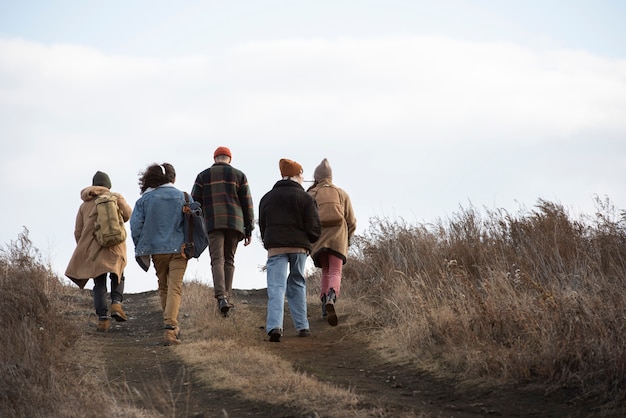 Free photo full shot friends walking together