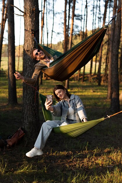 Full shot friends with hammocks