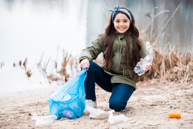 Full shot of girl cleaning the ground