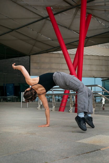 Full shot girl doing parkour training