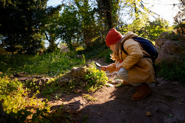 Free photo full shot girl exploring nature