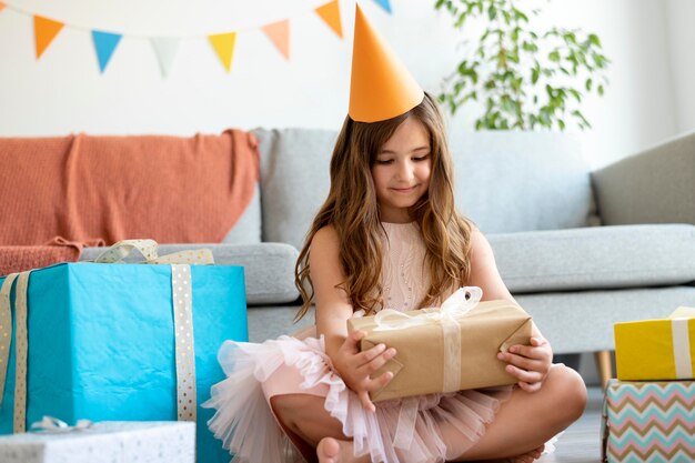 Full shot girl holding gift