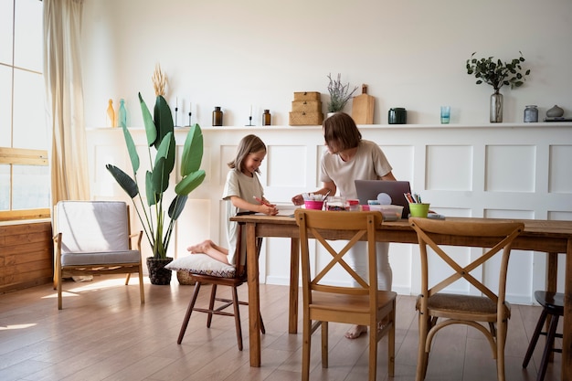 Full shot girl learning at home