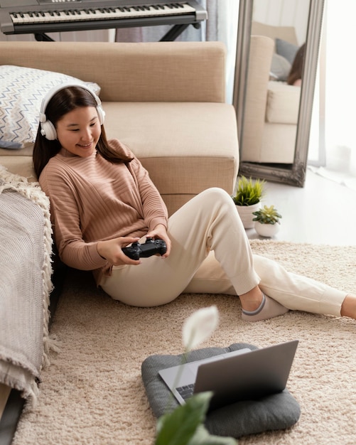 Free Photo full shot girl playing game