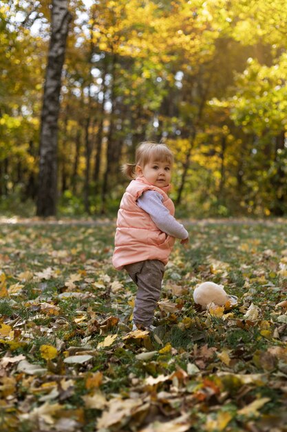 Full shot girl playing outdoors