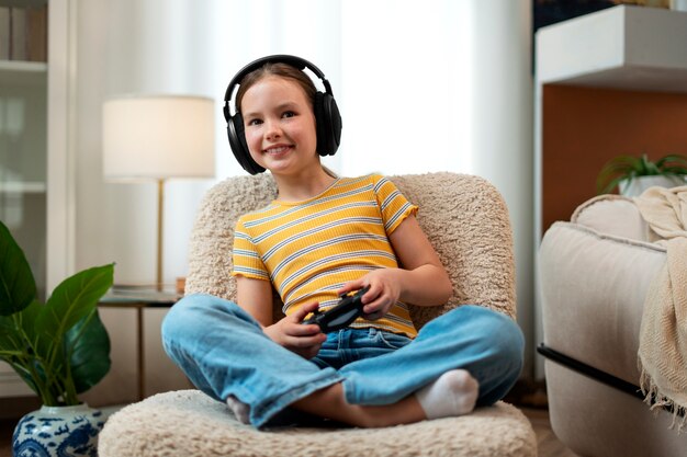 Free photo full shot girl playing videogames