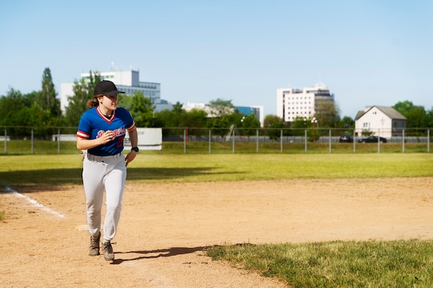 Full shot girl running on field