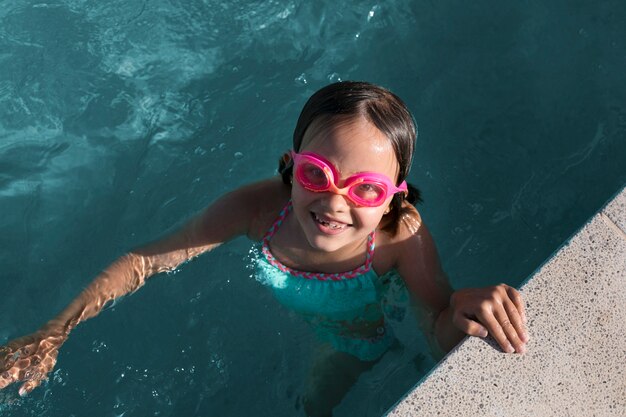 Full shot girl wearing goggles