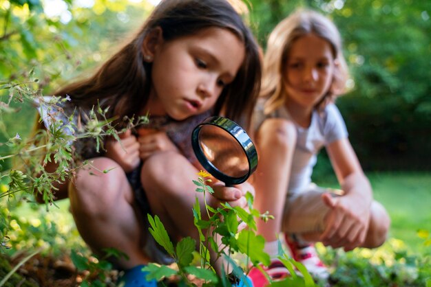 Full shot girl with magnifying glass