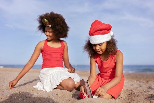 Full shot girls playing with sand