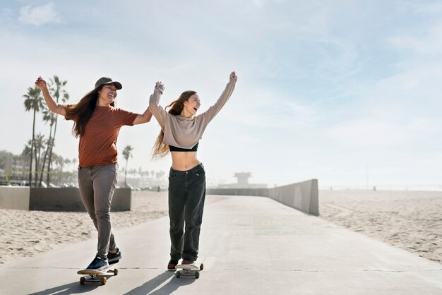 Full shot girls on skateboards