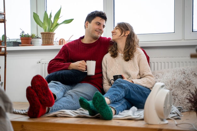 Full shot happy couple at home