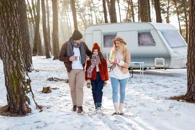 Full shot happy family in nature