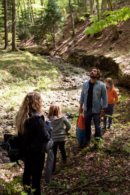 Full shot happy family in nature