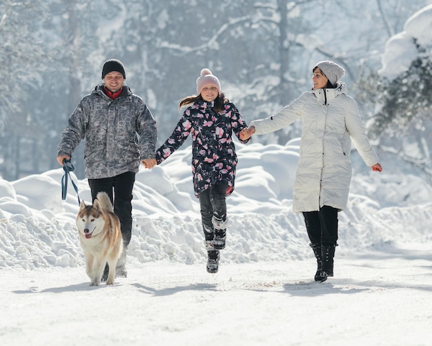 Full shot happy family outdoors