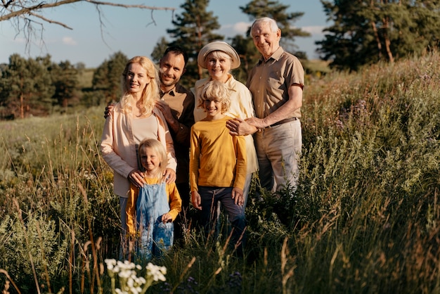 Full shot happy family outdoors