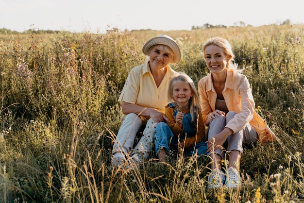 Full shot happy family outdoors