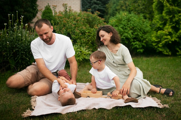 Full shot happy family outdoors