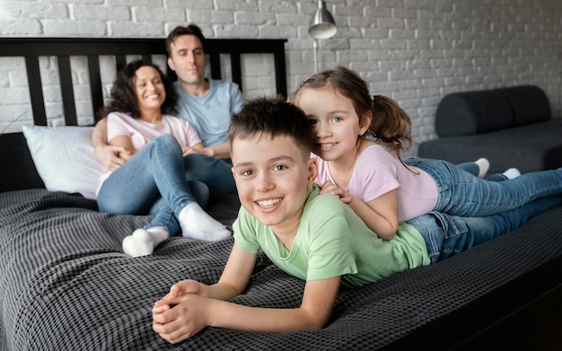 Full shot happy family posing together