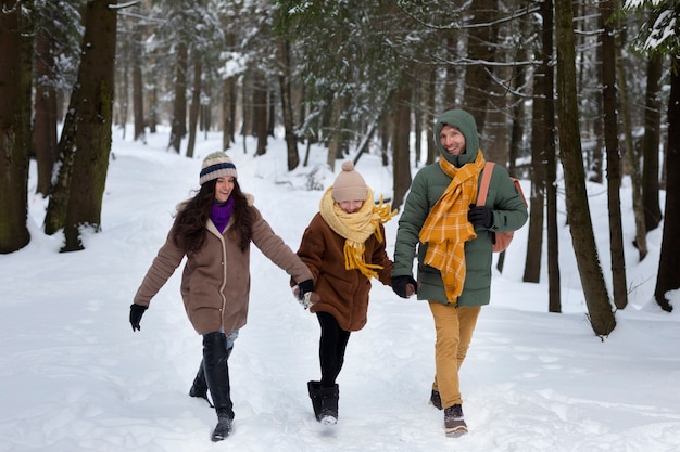 Full shot happy family walking together